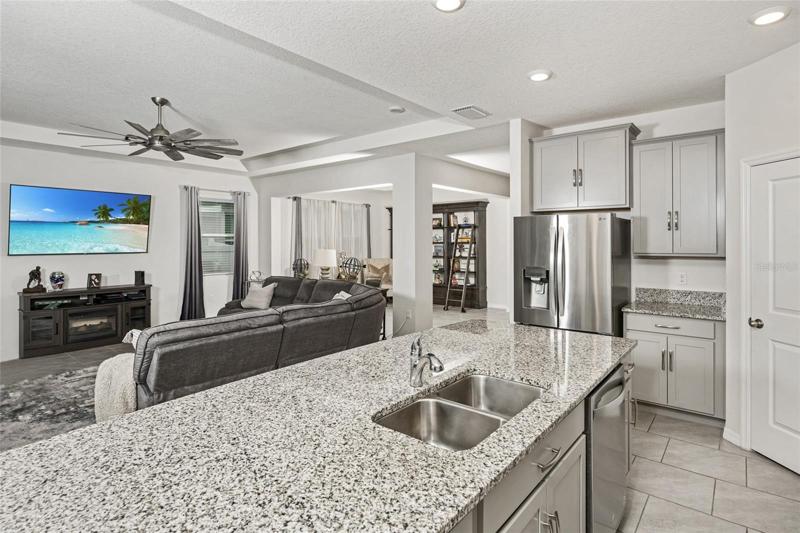 Kitchen quartz countertop with view of cabinets
