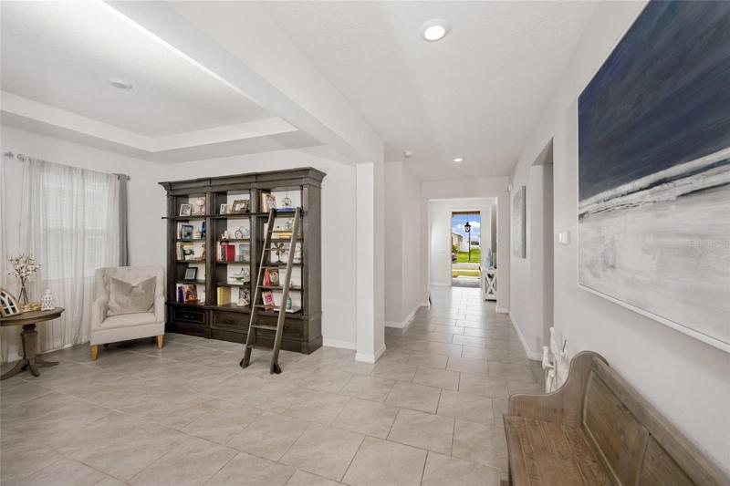 Formal dining area used as den/library