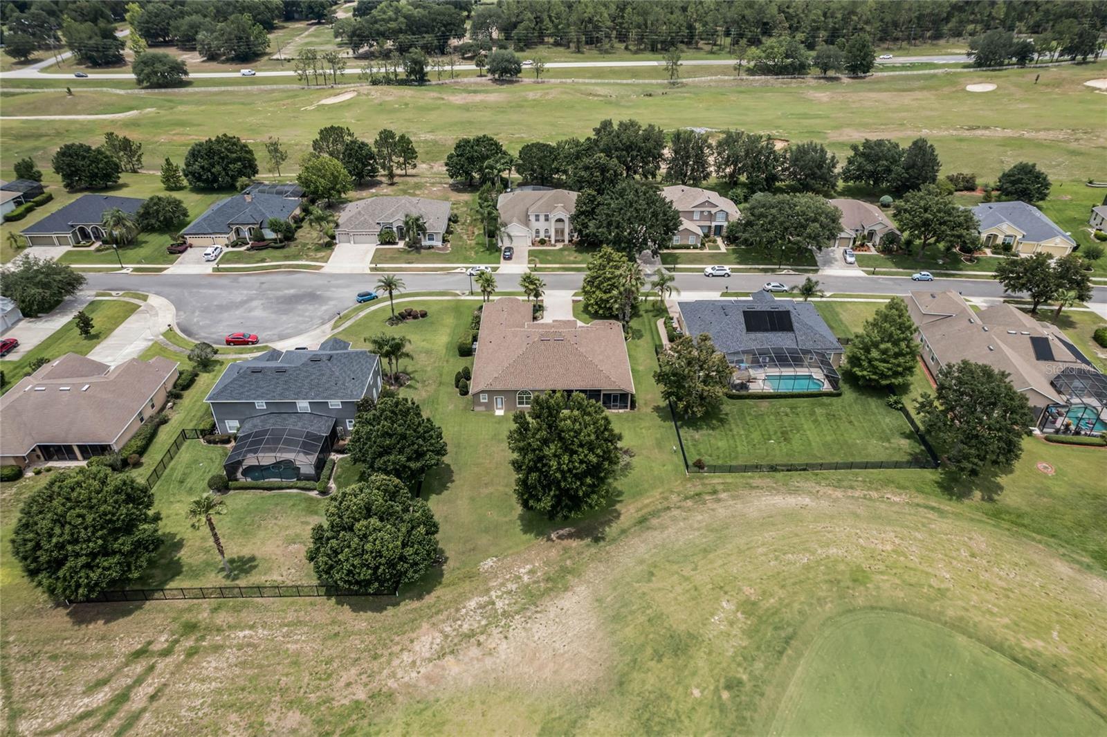 BACK OF HOME AERIAL VIEW: HOME IS STAGGERED IN RELATIONSHIP TO NEIGHBORS ALLOWING FOR ADDED PRIVACY.