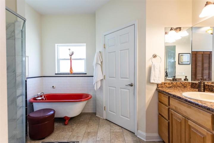 Master bath with adorable tub.