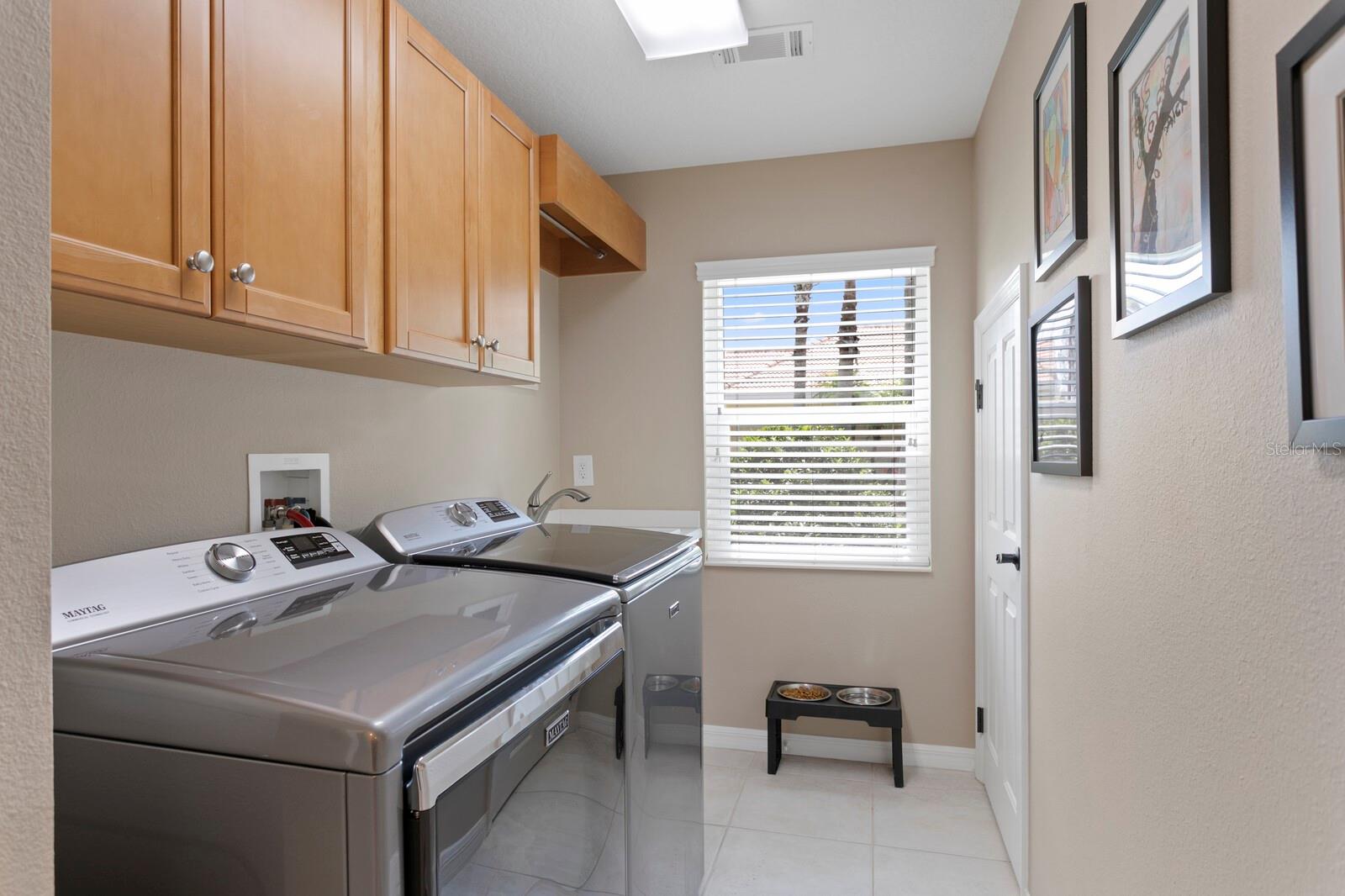 Two storage closets in the laundry room