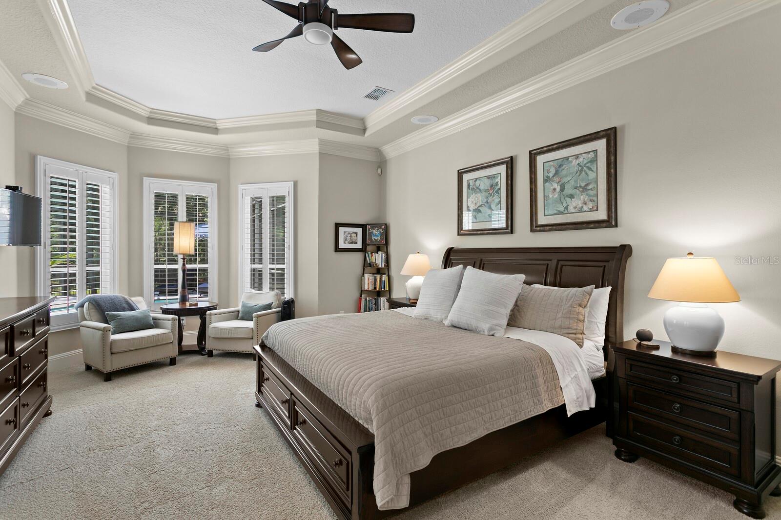 Coffered ceilings, crown molding and sitting area.