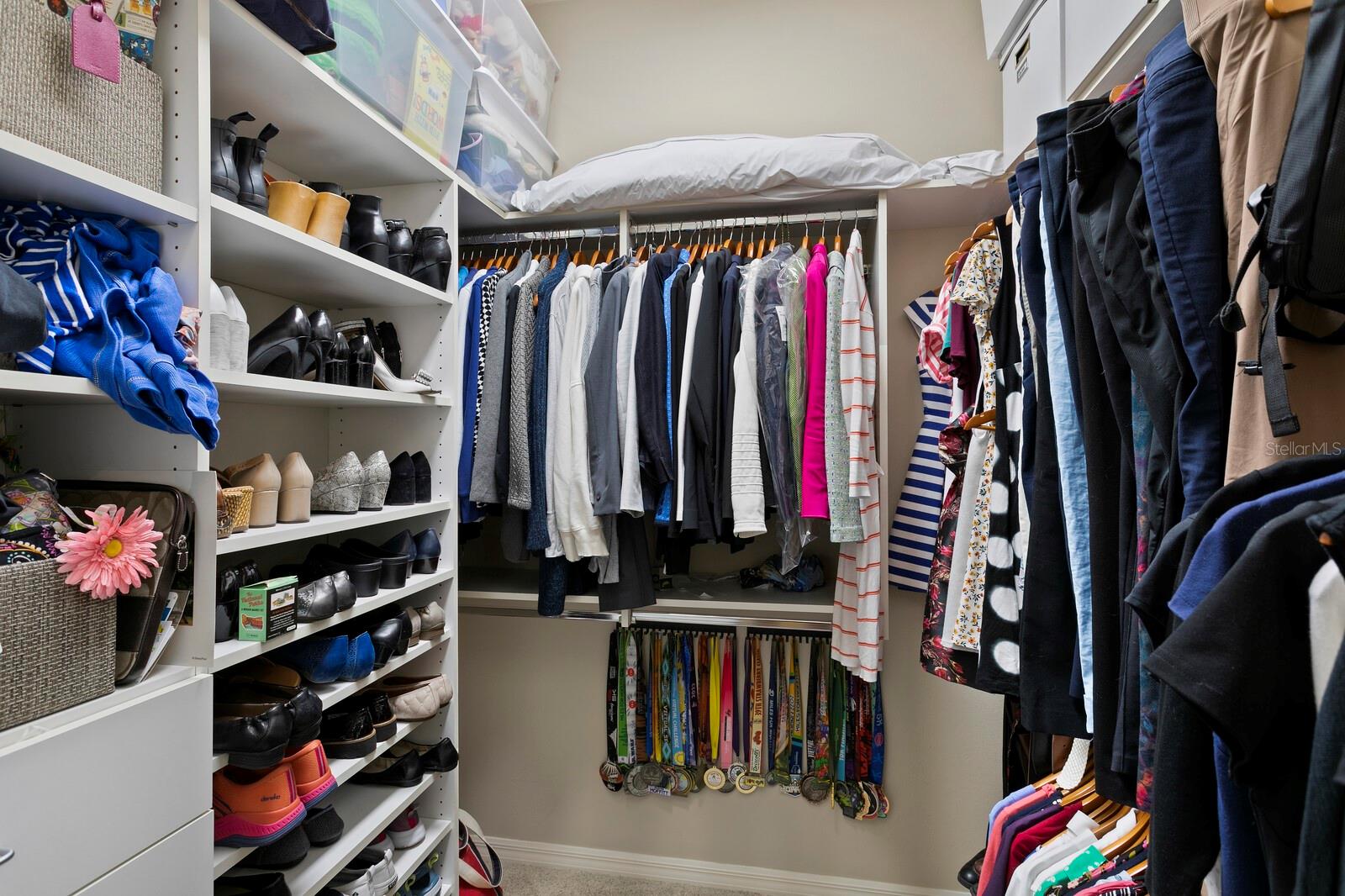 Walk-in closet with built-ins.