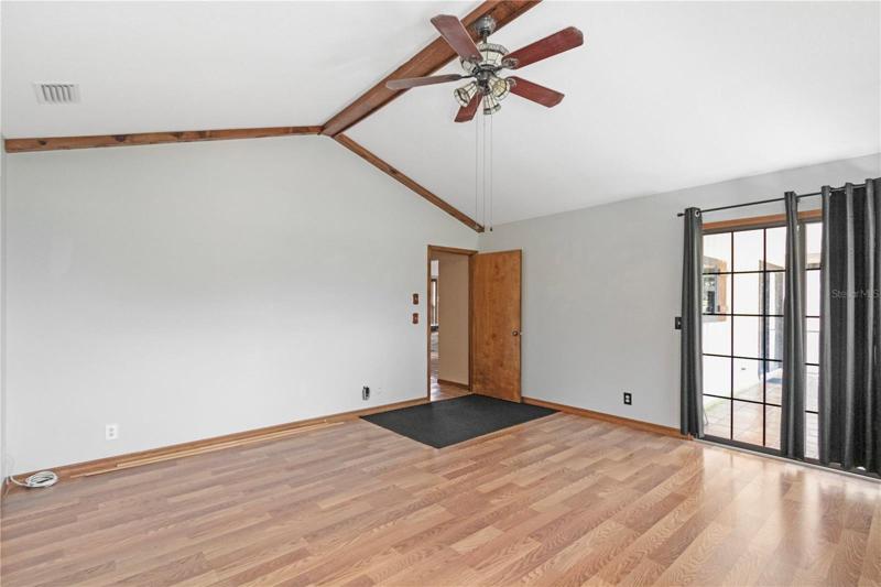Master Bedroom w/Sliders to back Porch