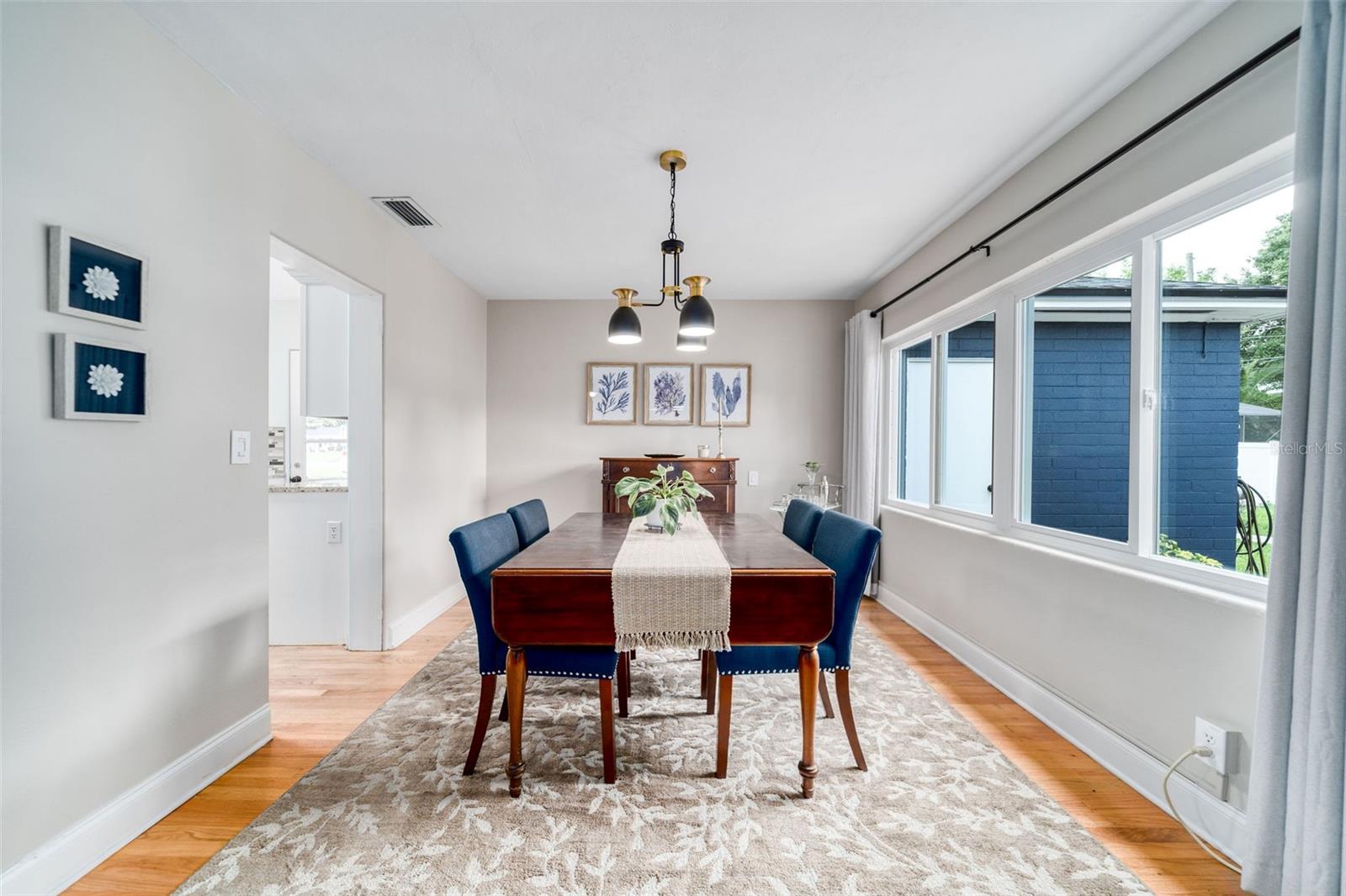 Dining Room overlooking rear yard and leading to Kitchen