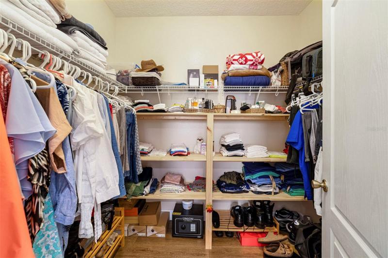 Owners Suite Closet with custom built-in shelving
