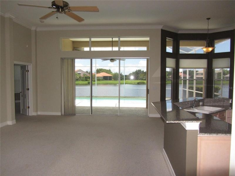 Living room overlooking pool and lake
