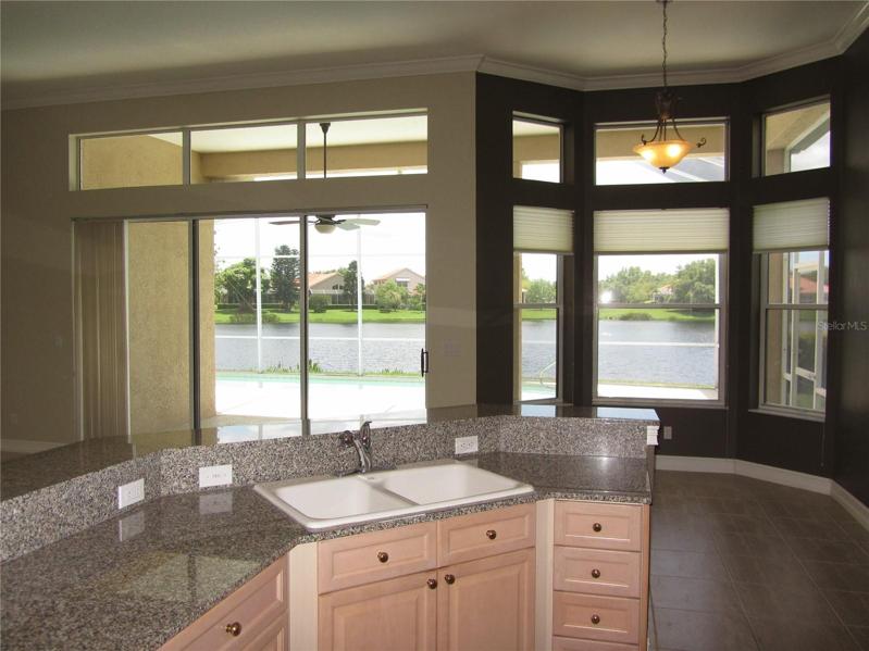 Kitchen overlooking pool and living room