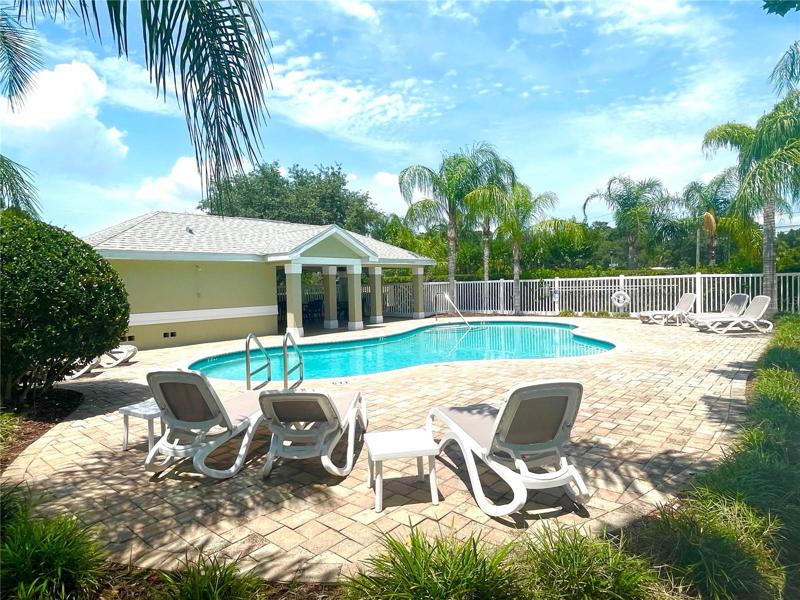 Beautiful community pool with covered and open seating.