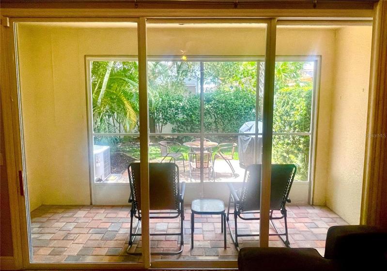 Full width sliders open to the lanai and patio
