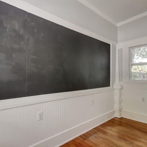 Small office area with large chalkboard.