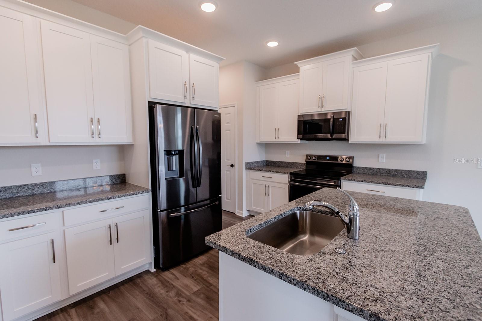 Interior photos are of a different property, same model.  This home has similar finishings.