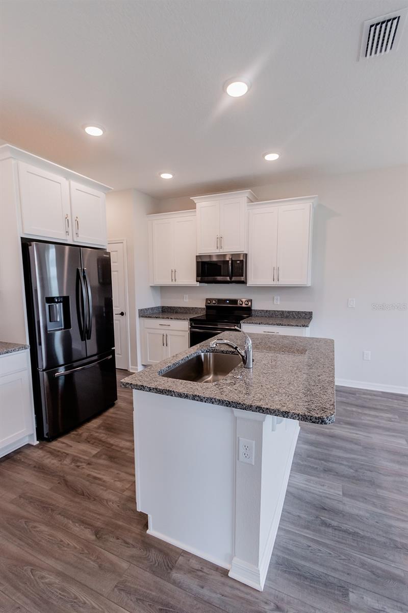 Interior photos are of a different property, same model.  This home has similar finishings.