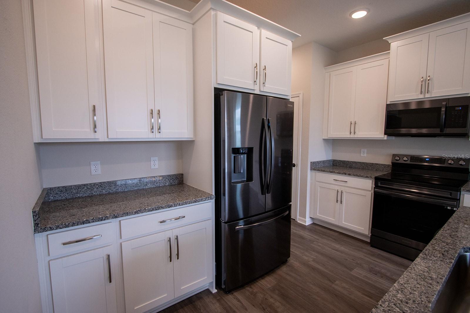 Interior photos are of a different property, same model.  This home has similar finishings.
