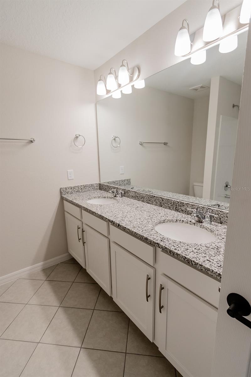 Interior photos are of a different property, same model.  This home has similar finishings.