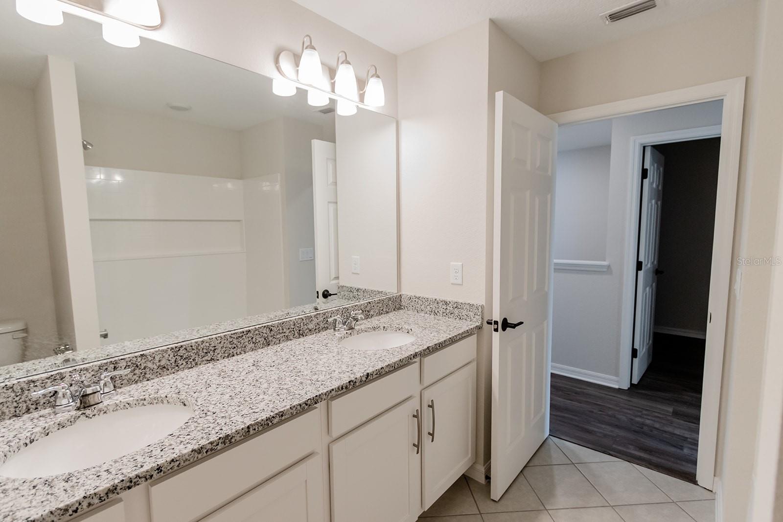 Interior photos are of a different property, same model.  This home has similar finishings.