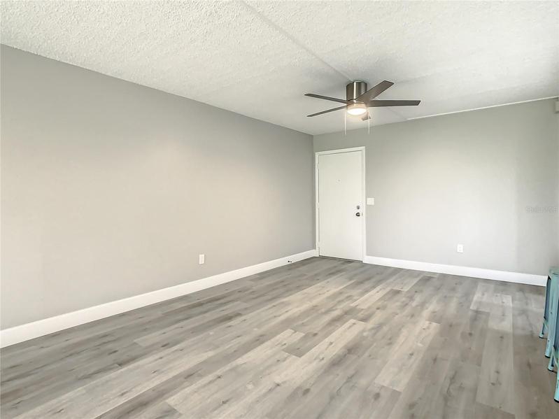 Main Living space luxury vinyl wood-look flooring that flows throughout the home