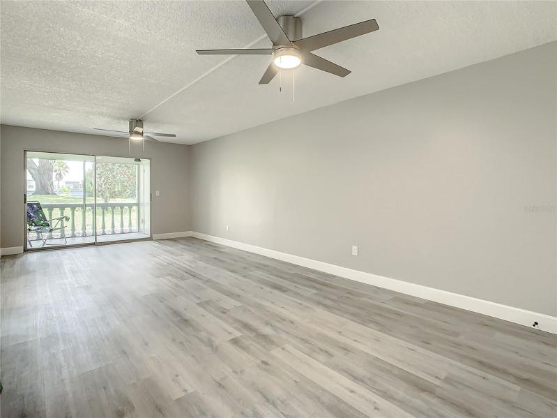 Main Living space luxury vinyl wood-look flooring that flows throughout the home