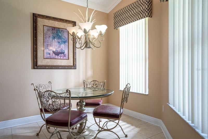 Kitchenette with attractive window treatments and vertical blinds