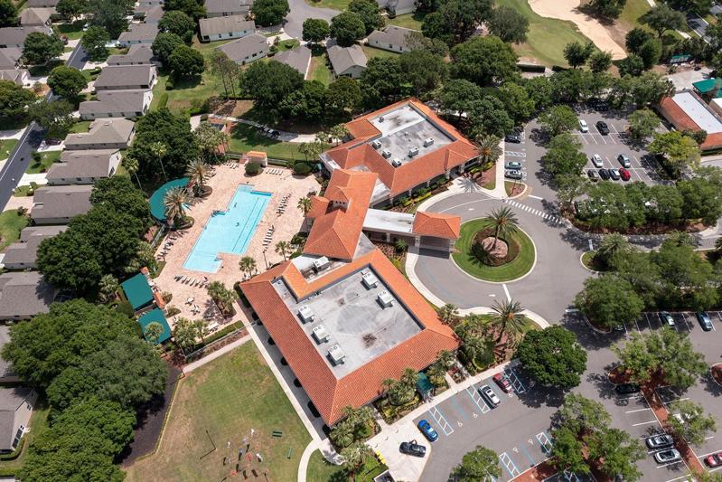 Aerial view of clubhouse pool area and parking lot