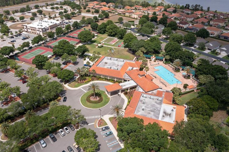 Aerial view of clubhouse pool tennis courts and parking lot