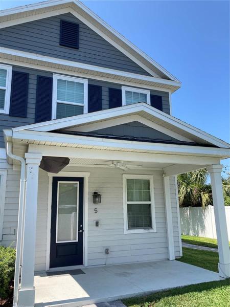 Porch with mounted TV folded to ceiling for storage