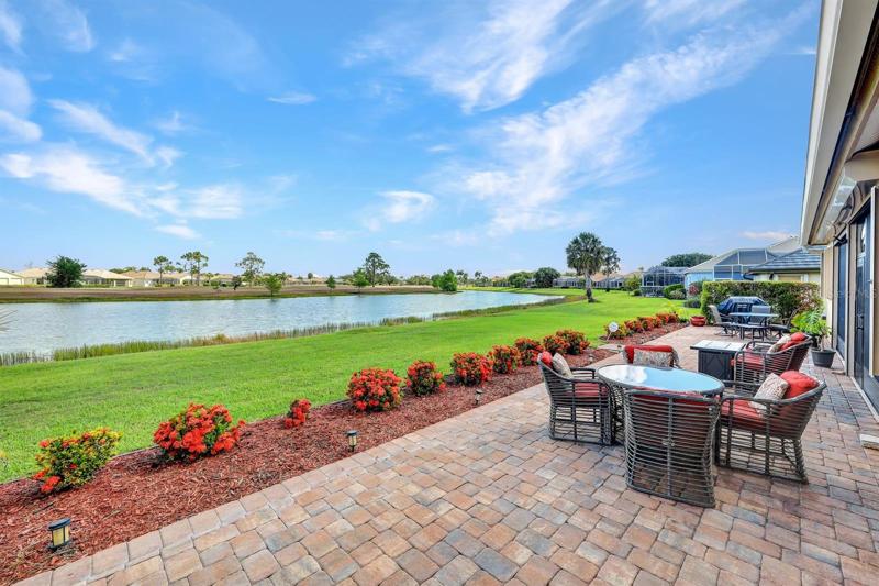 Patio with view of the lake and golf course