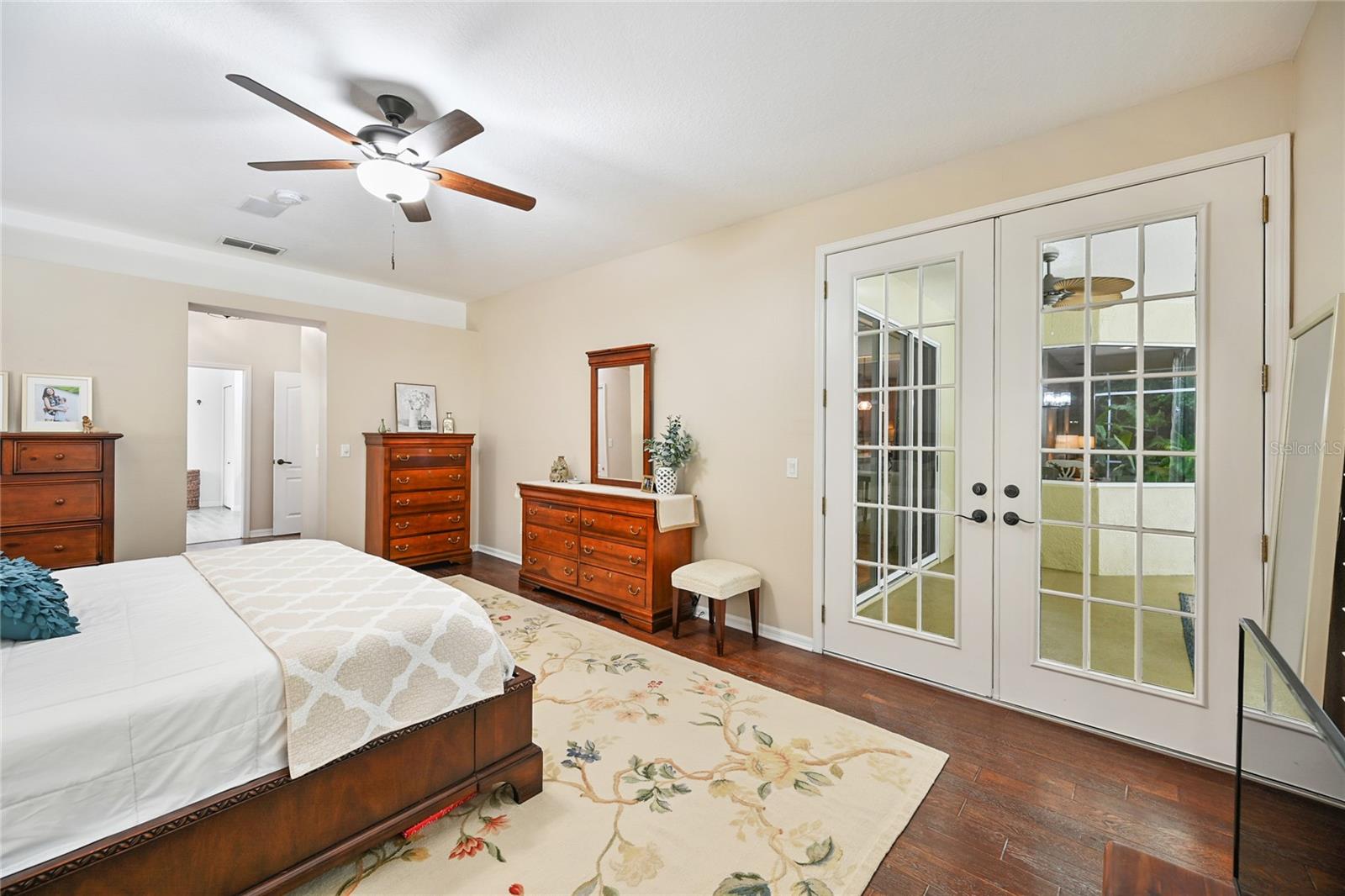 French doors from the owner's retreat to pool.