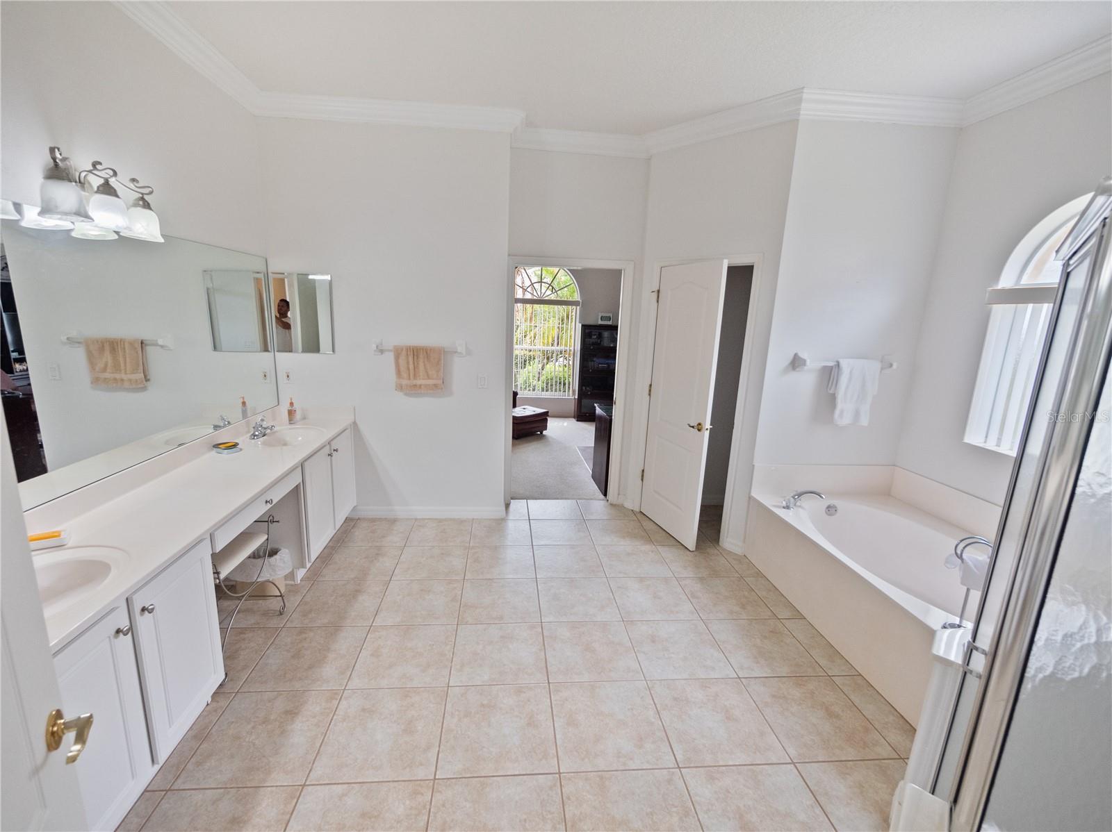 Master Bath with two sinks, shower, tub and separate water closet
