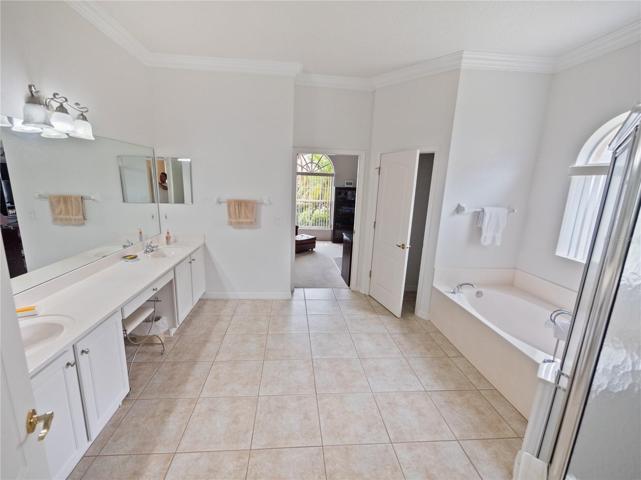 Master Bath with two sinks, shower, tub and separate water closet