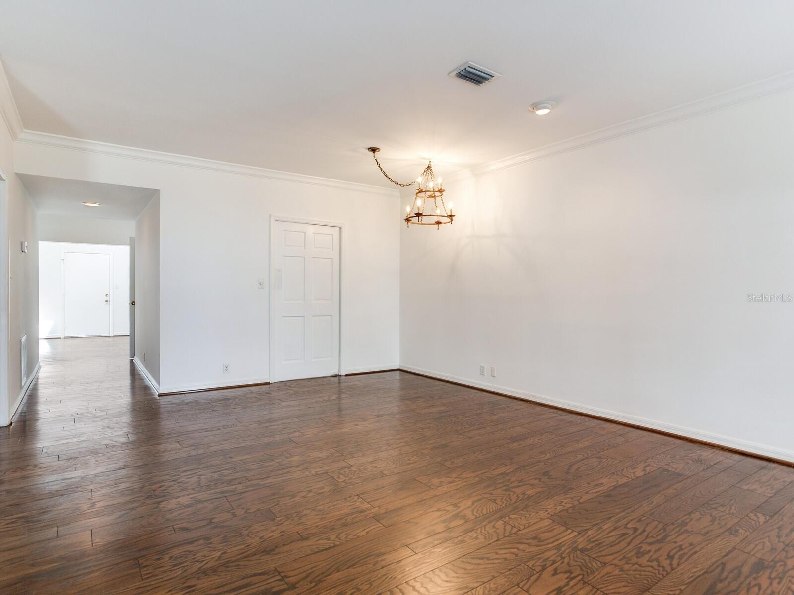 Dining area looking to swinging door leading to kitchen