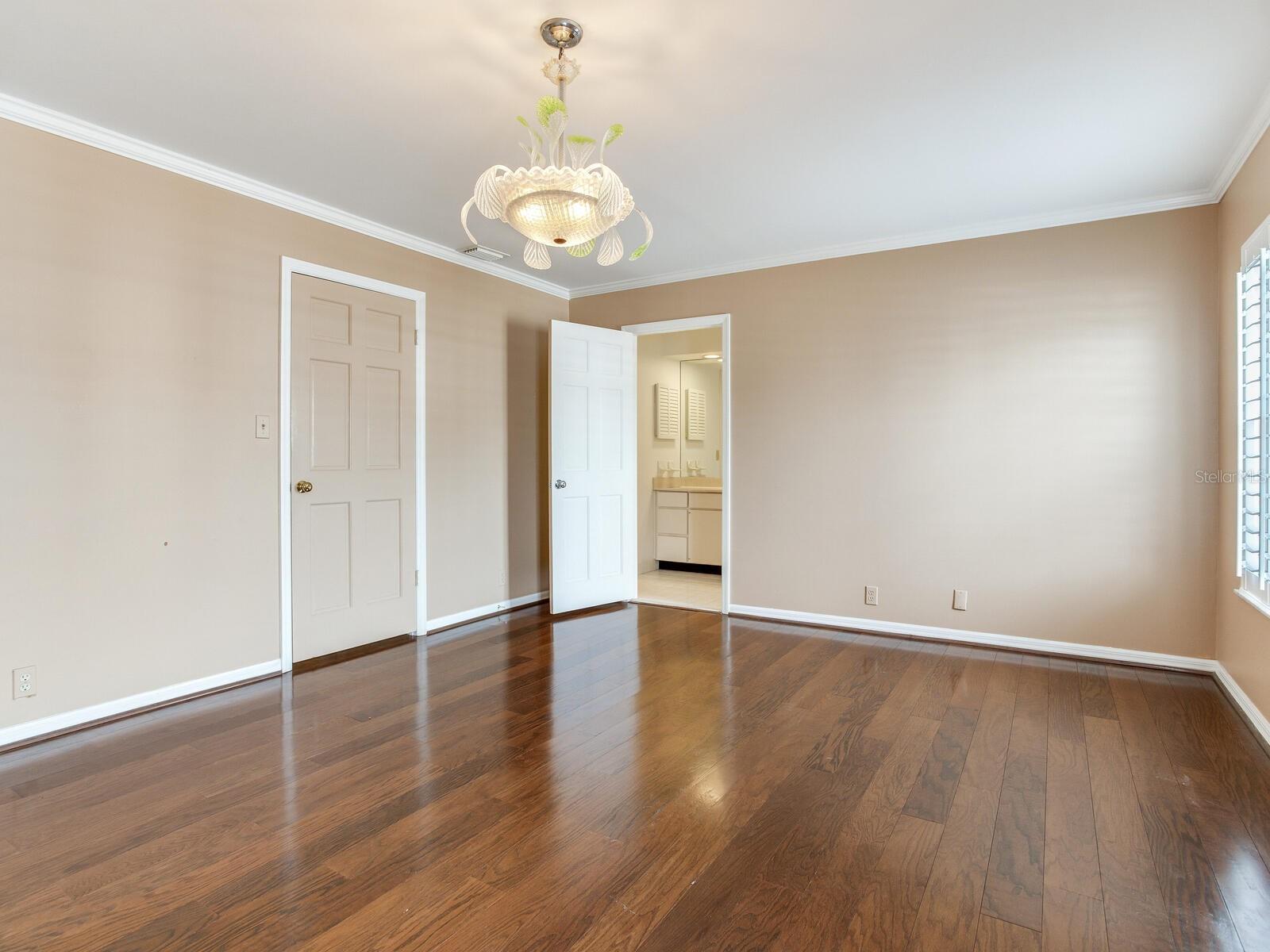 2nd bedroom 18 X 13 with wood flooring, double clostes and then a walk-in off bath and  Plantation shutters