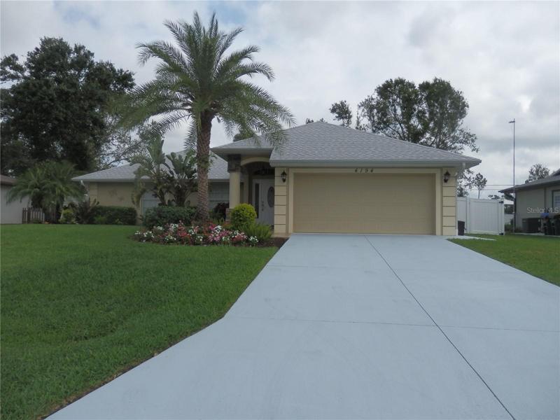 Beautiful pool home, 3 bedroom, 2 bath home with grand scale landscaping.