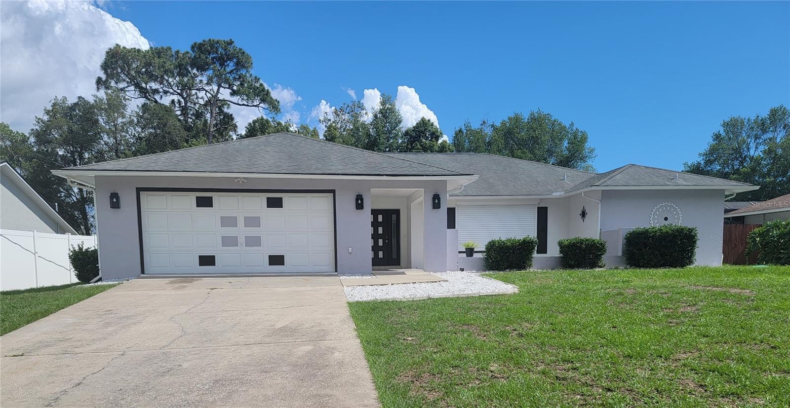 Front of home with hurricane shutters