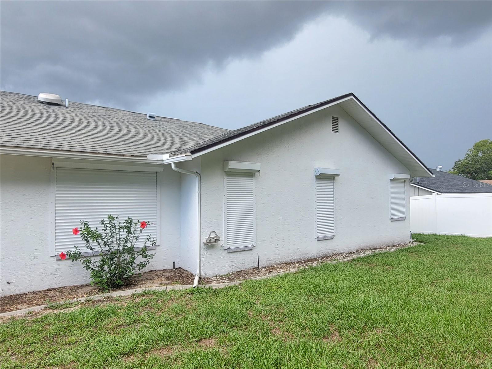 Hurricane shutters in back of home