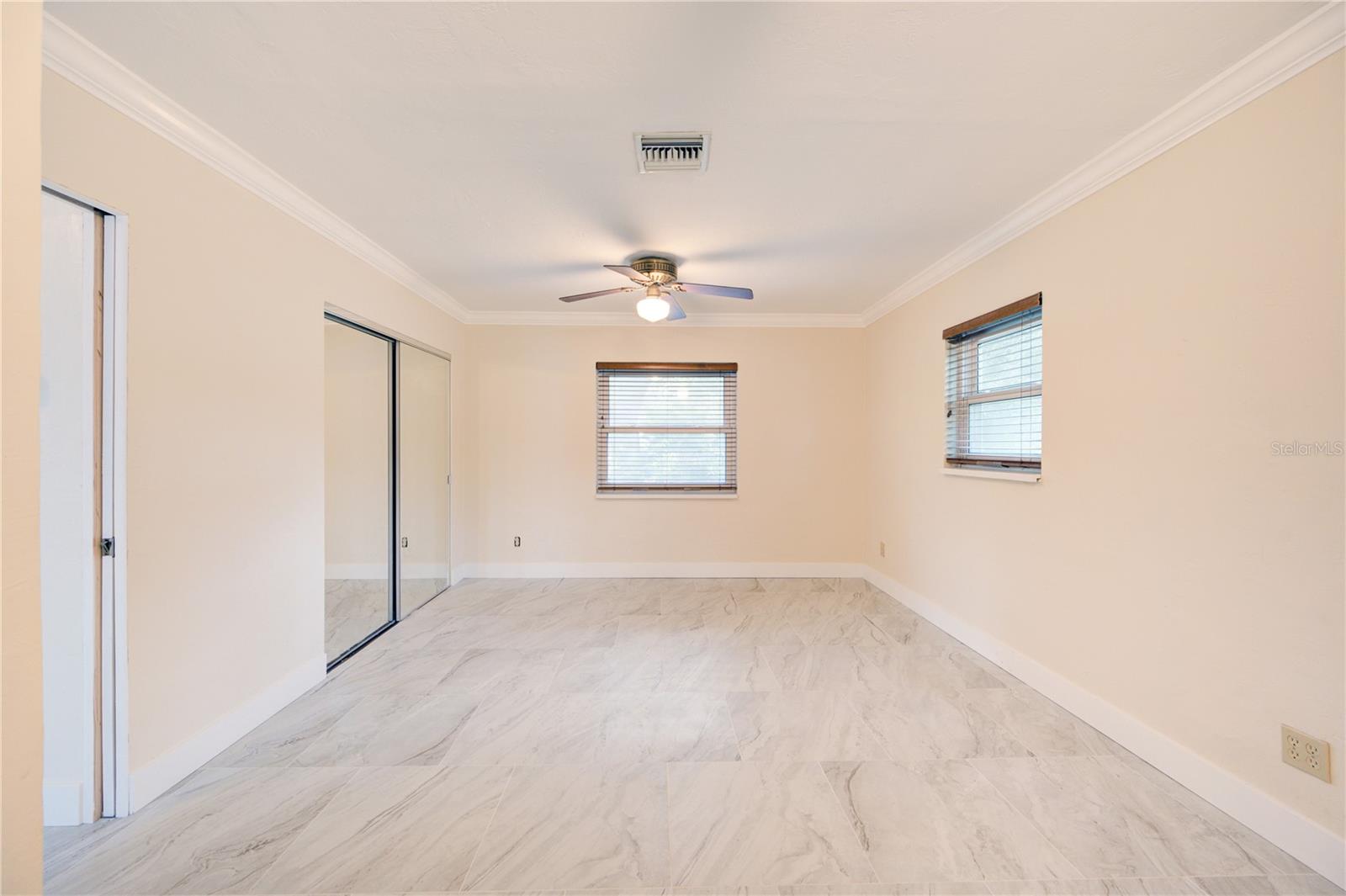 Master Bedroom 1 with brand new ceramic tile floors