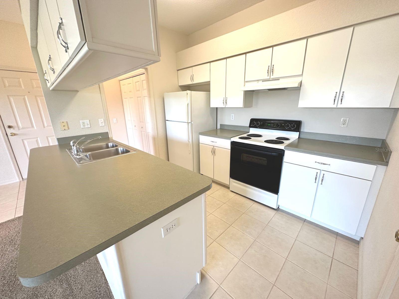 Spacious kitchen with breakfast bar.