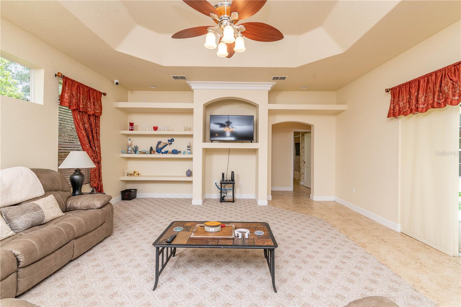 Family room large with built in shelving