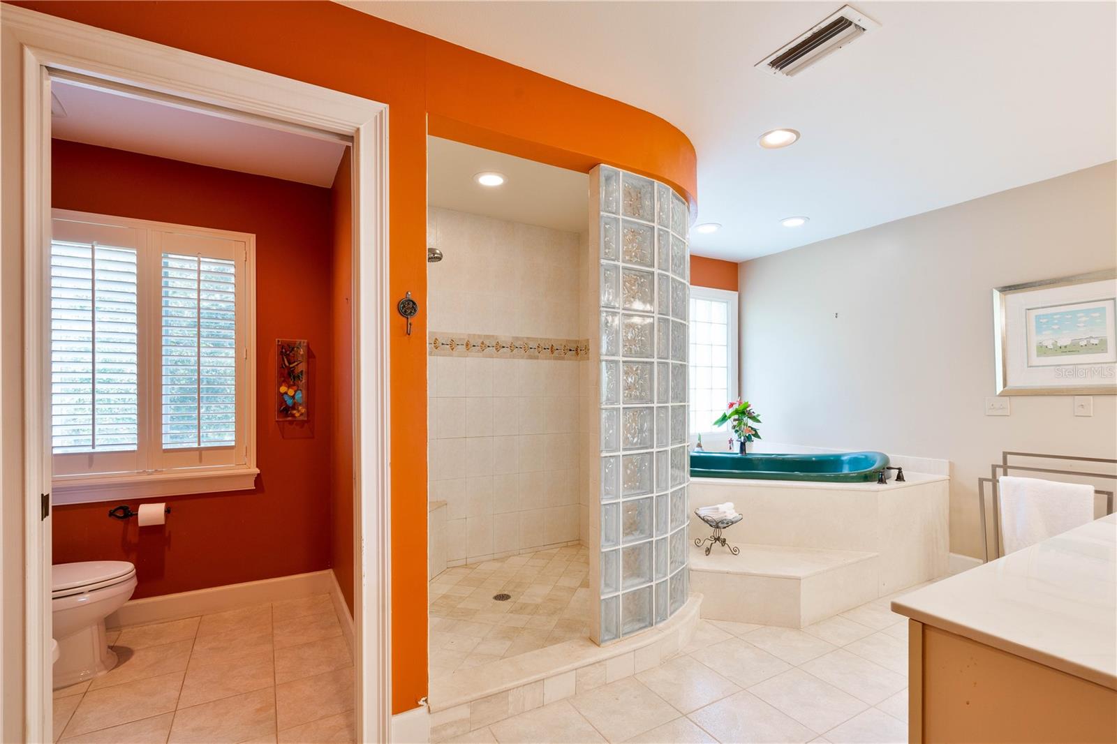 Water closet in ensuite with toilet &amp; bidet.