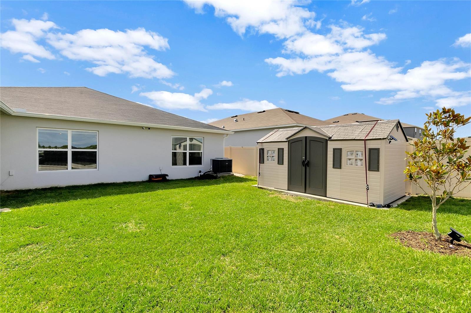 Additionally, there is a 15 x 8 utility shed on a concrete slab, providing extra storage and organization options. This shed is tied down, ensuring its stability.