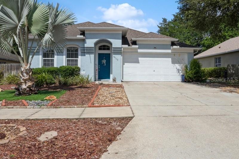 Front view with xeriscaped yard