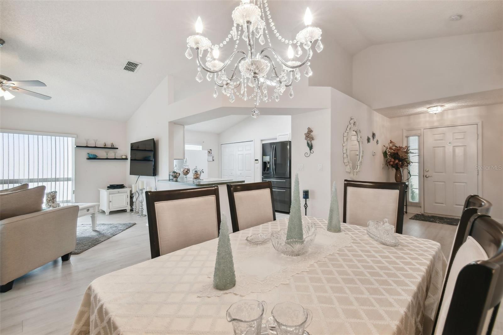 Chandelier adds an elegant touch to the open dining area