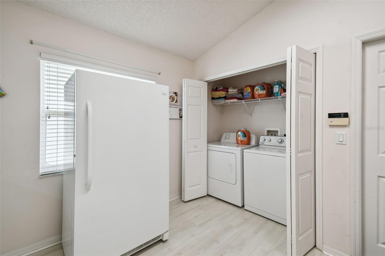A cute cafe table and chair set would work great near this window for eat in kitchen dining area.