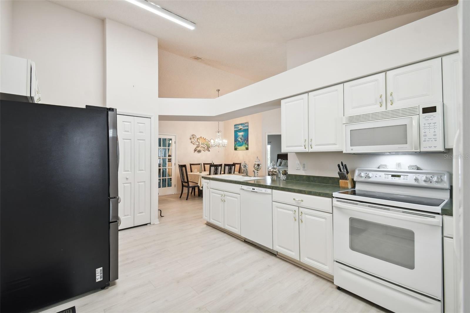 A closet pantry and adjoining corner cabinet create even more storage space