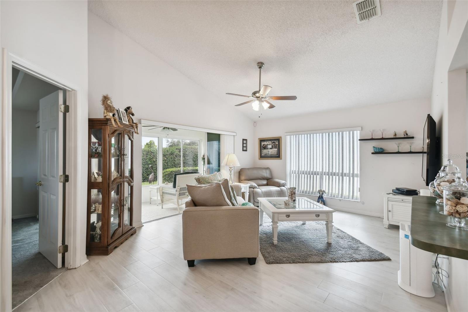 Step into the great room area which is adjoined by the kitchen, master suite and lanai