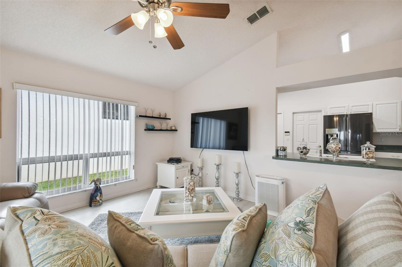 Cheerful great room area is open to the kitchen