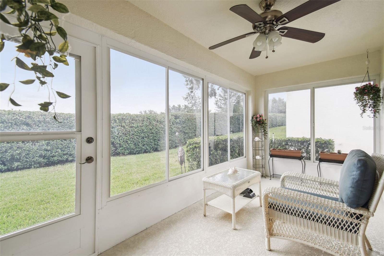 Sliding plexiglass windows on the lanai can be opened to create a screened room