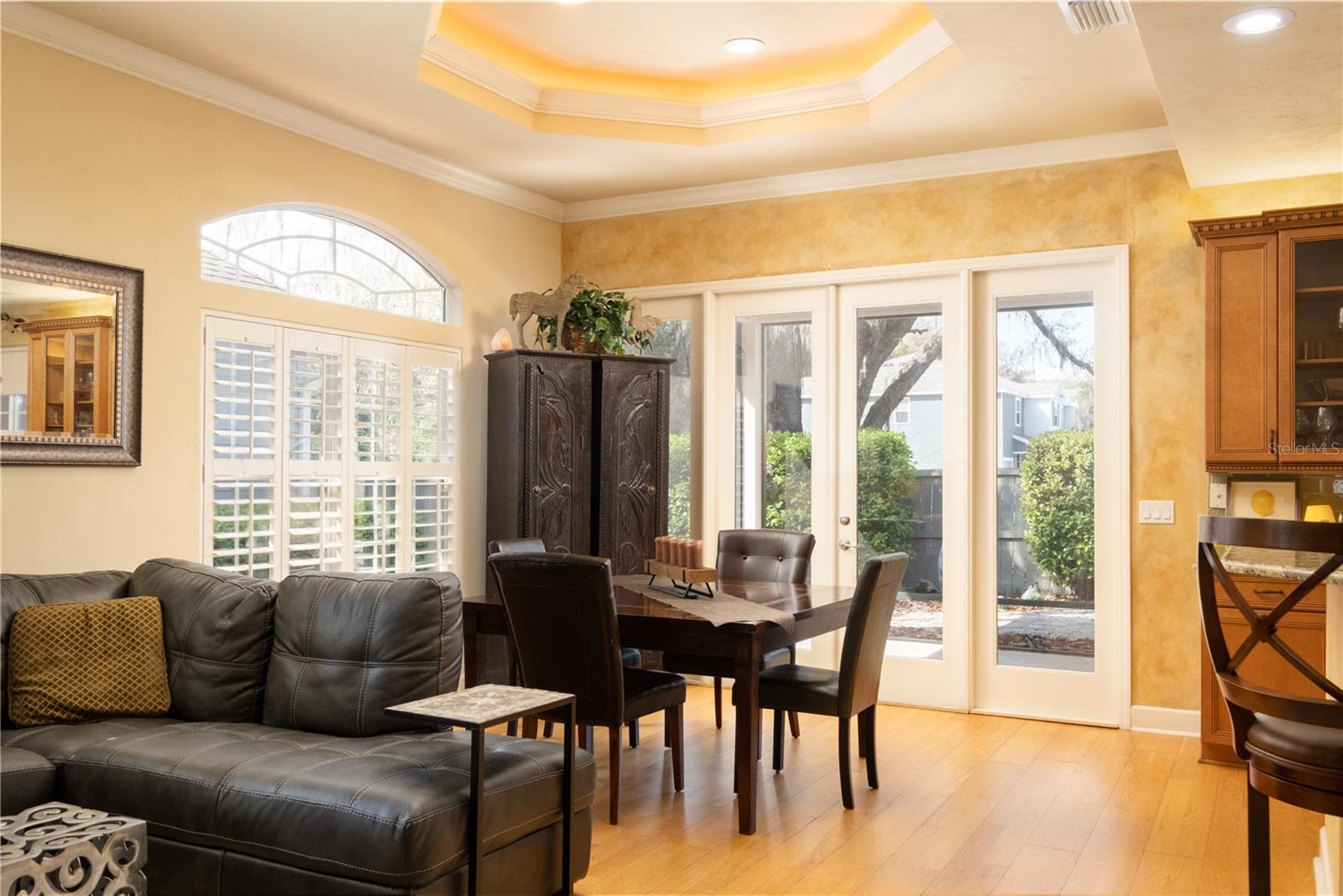 DEDICATED DINING AREA WITH FRENCH DOORS TO LANAI