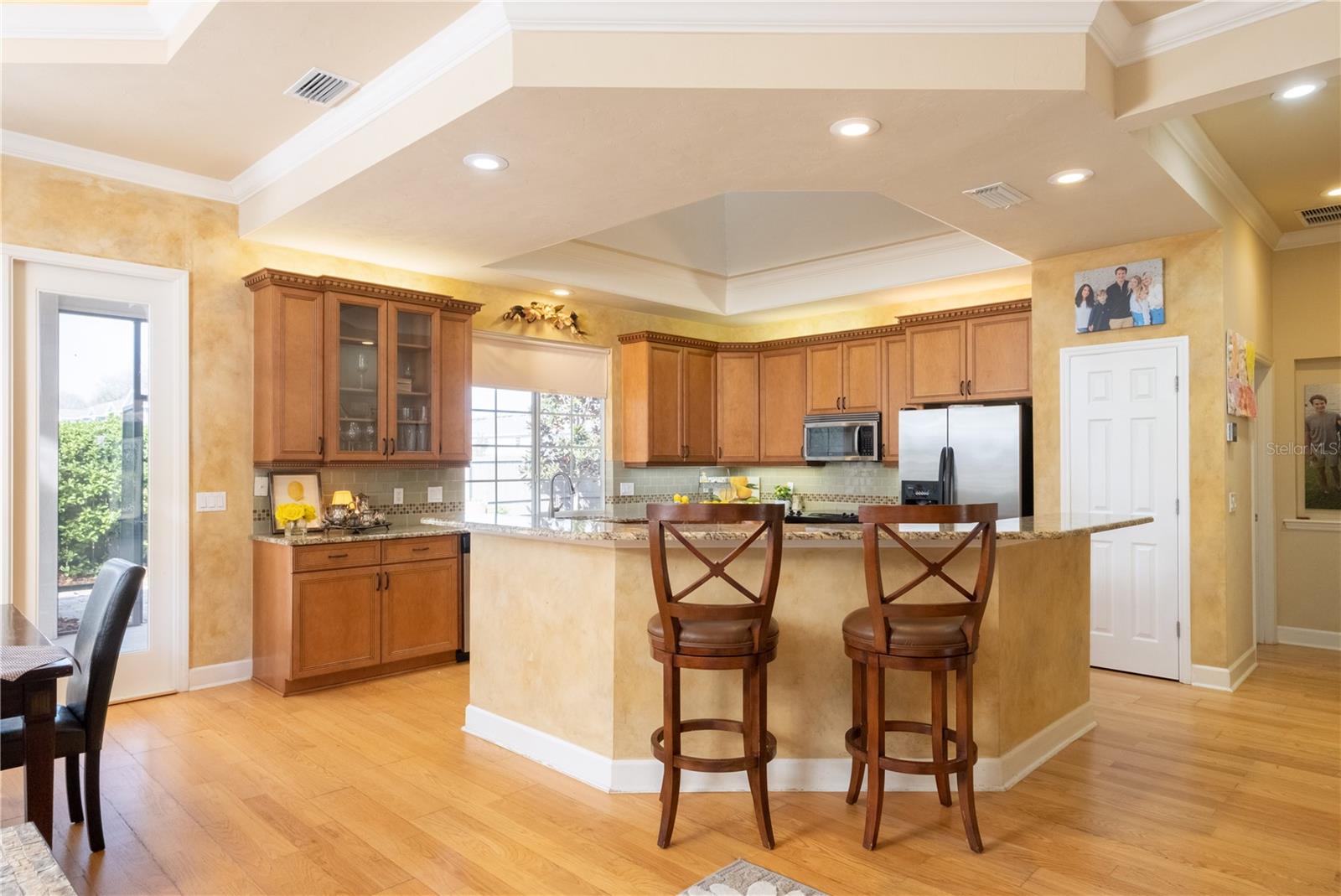LARGE CUSTOM KITCHEN WITH BUILDER'S TRADEMARK SKYLIGHT