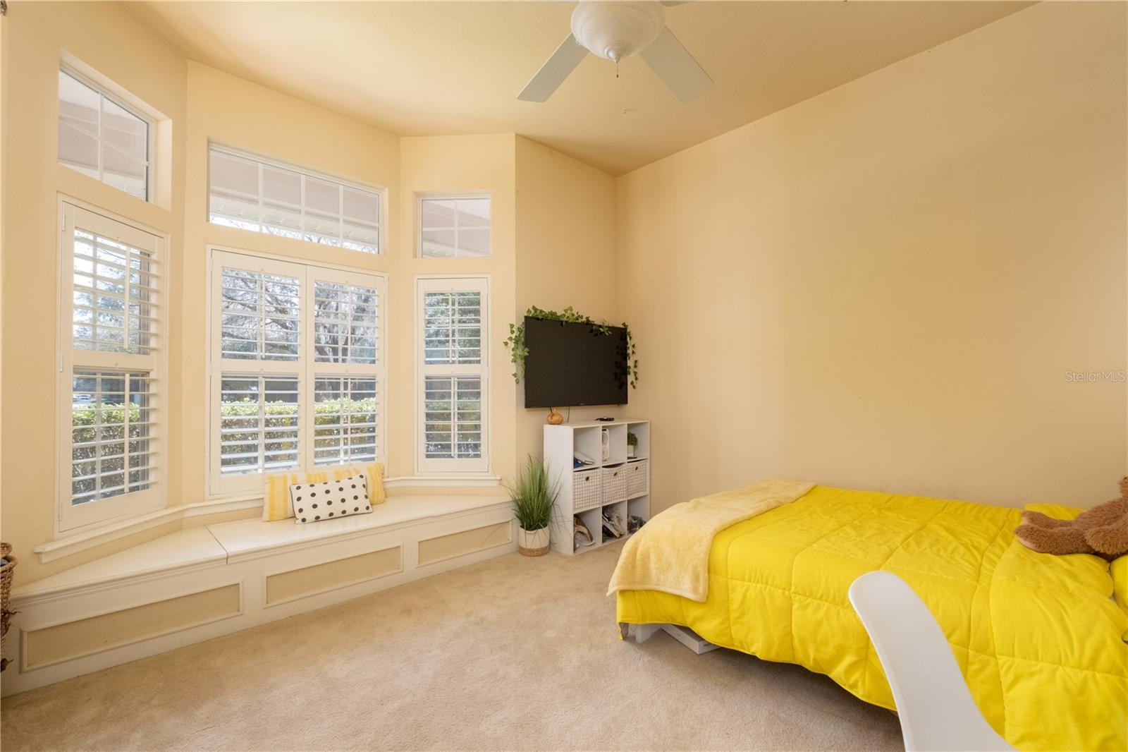 GUEST BEDROOM # 1 WITH BAY WINDOW WITH SEAT AND STORAGE